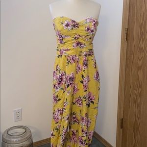 Yellow floral romper with a sweetheart  neckline.